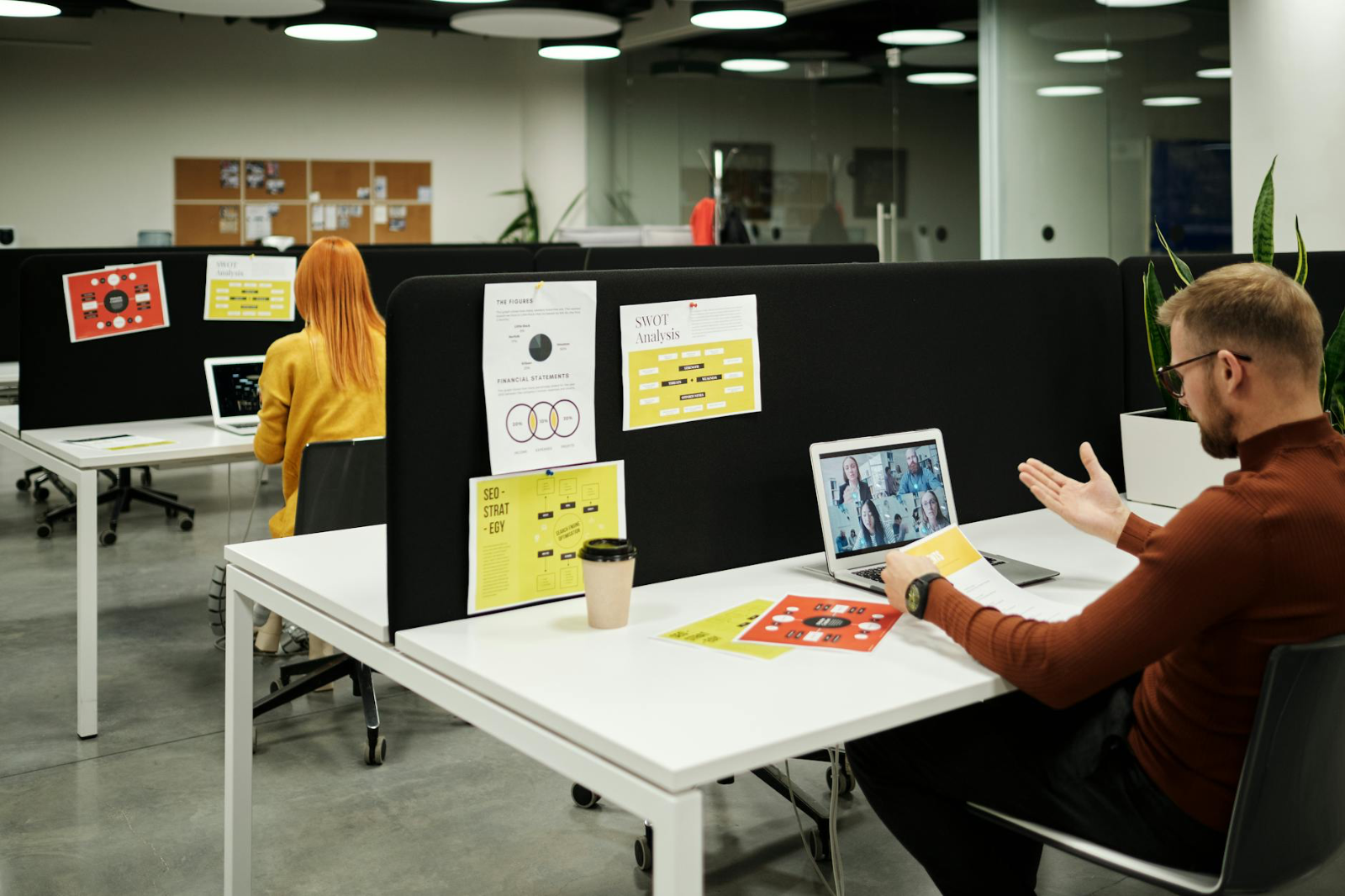Mondaq Analytics vs JD Supra vs - Colleagues working and collaborating virtually at a stylish modern office workspace.