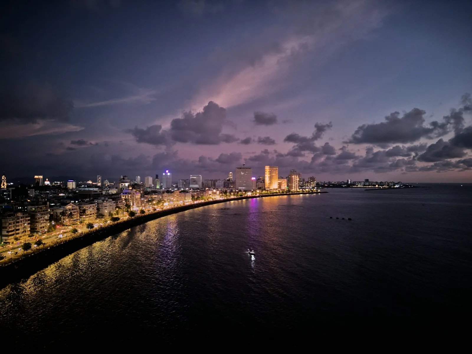 Marine Drive curving along the sea in Mumbai at dusk